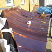 Bright copper porch canopy, HRH Prince Charles buildings, Poundbury, Dorchester © Mike White Ltd