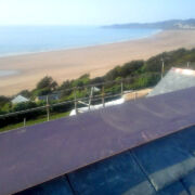 Copper flashings, guttering, valleys and ridge flashing at Putsborough Beach, Devon © Mike White Ltd