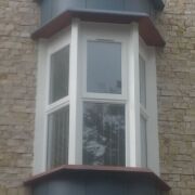 Zinc covered oriel windows in VM Zinc pigmento blue, Clevedon