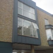 Zinc covered oriel windows in VM Zinc pigmento blue, Clevedon