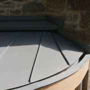 VM Zinc Quartz roof with a curved stainless steel secret gutter lining, St Stephens Church, Charlton Musgrove,Wincanton