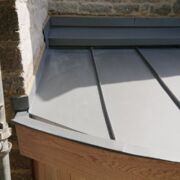 VM Zinc Quartz roof with a curved stainless steel secret gutter lining, St Stephens Church, Charlton Musgrove,Wincanton