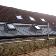 Raised rooflights on a VM Zinc roof to an extension to a private farmhouse