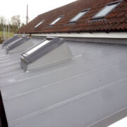 Raised rooflights on a VM Zinc roof to an extension to a private farmhouse
