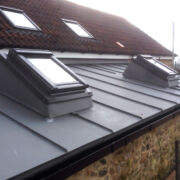 Raised rooflights on a VM Zinc roof to an extension to a private farmhouse